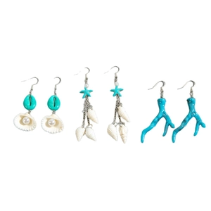 Three-piece set of ocean-inspired earrings featuring starfish, seashells, and coral motifs