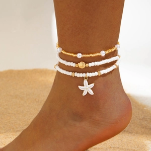 Set de tobilleras bohemias con cuentas y dijes de estrella de mar y caracola