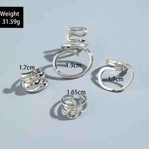 Detail view of four silver irregular geometric rings with diameter size labels