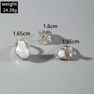 Three-piece silver ring set featuring baroque pearls and lava texture, weighing 24.39g
