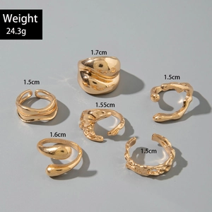 Detail view of 6-piece irregular gold ring set showing textures and specific dimensions