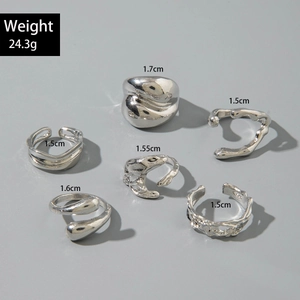 Detail view of irregular liquid metal silver rings set with weight and size specifications