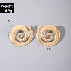 Detail of gold geometric spiral earrings with striped texture and dimensions marked