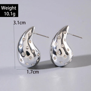 Detail view of irregular teardrop earrings with crystals, size 3.1cm by 1.7cm