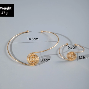 Detail view of gold snake chain swirl jewelry set with specific size measurements