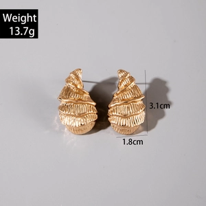 Macro view of gold geometric earrings with layered thread texture and dimensions