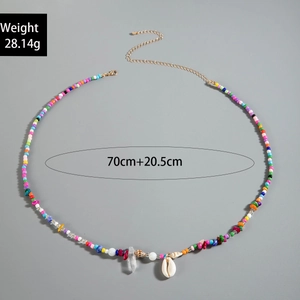 Detail view of Bohemian waist chain with colorful beads, white shells, and size specs