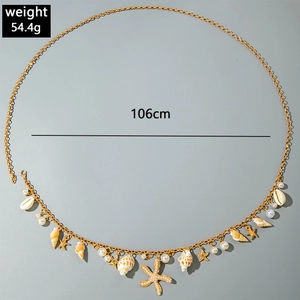 Detail of 106cm bohemian gold chain with shells, starfish, pearls, and sea elements