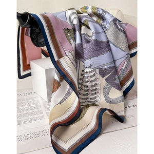 Silk twill square scarf with retro European print hanging on a hook in stylish setting
