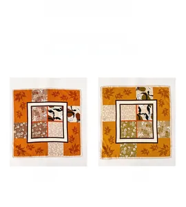 Detail of silk twill square scarf showing double-sided different colors and maple patterns
