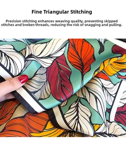 Detailed macro view showing the precise triangle needle stitching on printed silk scarf edges