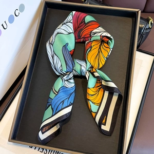 Luxurious twill silk square scarf with bold leaf prints and contrasting vibrant colors