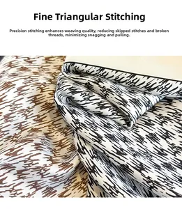 Detailed close-up showing fine triangular stitch hem on the plaid silk neck scarf