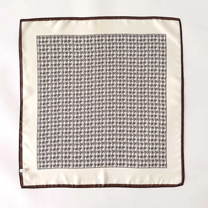 Silk feel square scarf with plaid pattern and brown trim on a white background