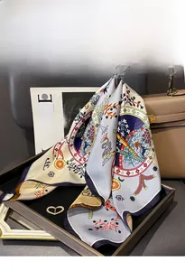 Close-up of a double-sided silk twill scarf with vintage hand-painted animal patterns