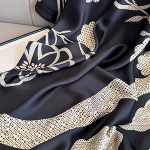 Elegant floral camellia silk scarf with black and white abstract print and grid texture