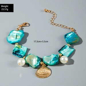 Detailed shot showing blue mother-of-pearl shell bracelet with 23.57g weight and size info