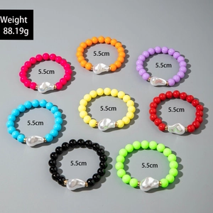 Detailed set of 8 colorful beaded bracelets with baroque pearls and gold spacers