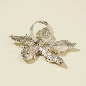 Detailed view of adjustable silver bee ring with intricate engraved wing textures