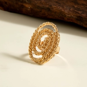 Detailed view of adjustable golden twisted rope ring with layered oval floral design