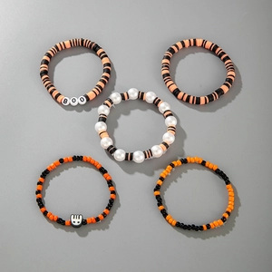 Halloween 5-piece bracelet set with orange and black beads featuring BOO lettering