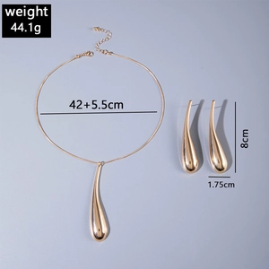 Detailed view of gold teardrop jewelry set with necklace and earring size specifications