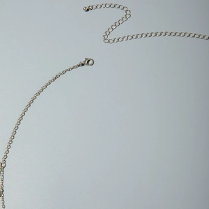 Silver multilayer body chain with adjustable lobster clasp and polished metal ball detail