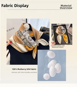 Détail d'un foulard en soie 100% mûrier avec motifs floraux et cocons de soie