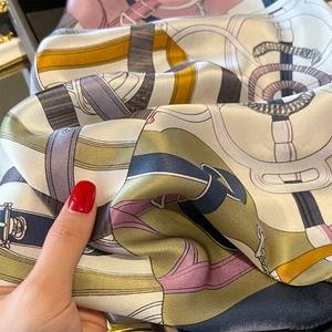 Silk square scarf featuring equestrian harness print and contrast color blocking