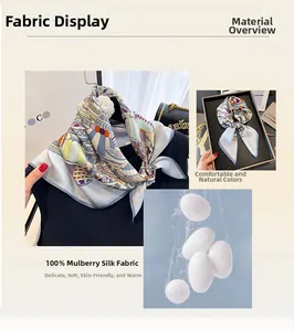 Detailed view of 100% mulberry silk scarf with geometric patterns and soft texture