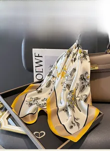 Detail of luxury mulberry silk square scarf with vintage floral and bird patterns