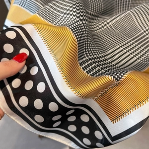 Polka dot and yellow stripe silk scarf with minimalist patchwork design and soft texture