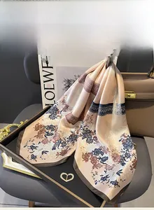 Detailed close-up showing the smooth mulberry silk texture and retro floral print of the scarf