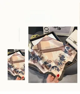 Detail of silk square scarf featuring vintage rose print and hand-rolled edges