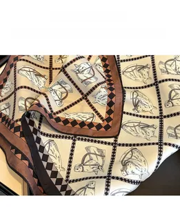 Detail view of fine triangle needle stitching on horse print silk square scarf