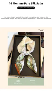 Detail of 14mm mulberry silk scarf featuring large white rose print on green fabric