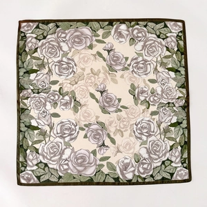 Silk square scarf with beige base and grey rose floral print with green leaf edge