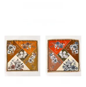 Close-up of double-sided silk scarf featuring realistic floral prints and contrast colors