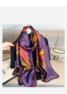Close-up of purple silk shawl with yellow sunflower patterns and ethnic border details