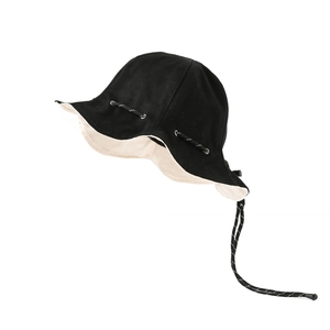 Two-tone black and beige canvas bucket hat with adjustable stripe drawstring for camping