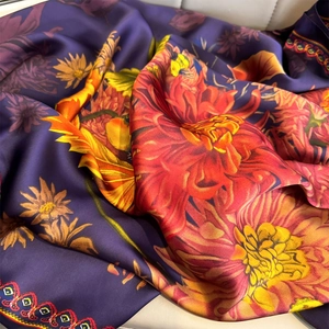 Deep purple silk-feel scarf with vibrant floral patterns and elegant satin texture
