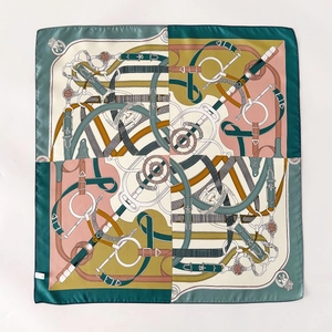 Silk twill square scarf featuring equestrian patterns with horse bits and straps