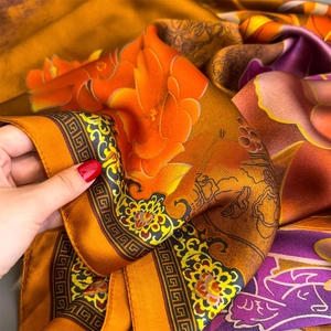 Long floral print faux silk scarf with elegant peony patterns and golden borders