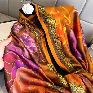Elegant floral print silk shawl scarf in vibrant orange and burgundy for sun protection