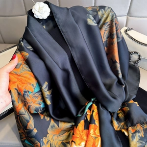 Elegant black satin silk floral scarf with orange flower print for sun protection