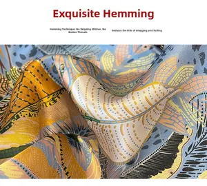 Detail of blue and yellow silk scarf showing exquisite hand-rolled edges and smooth texture