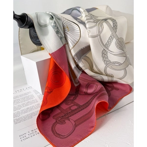 Luxurious double-sided silk square scarf featuring elegant equestrian patterns and motifs