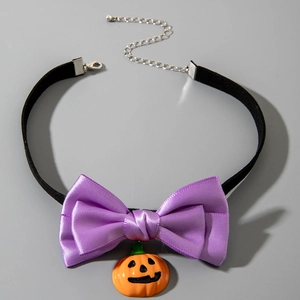Halloween choker with black velvet band, purple satin bow, and pumpkin charm pendant