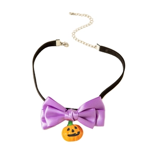 Halloween choker necklace featuring purple satin bow and smiling pumpkin charm pendant
