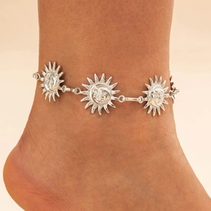 Vintage silver sunflower anklet with celestial sun face charms for a retro ethnic look